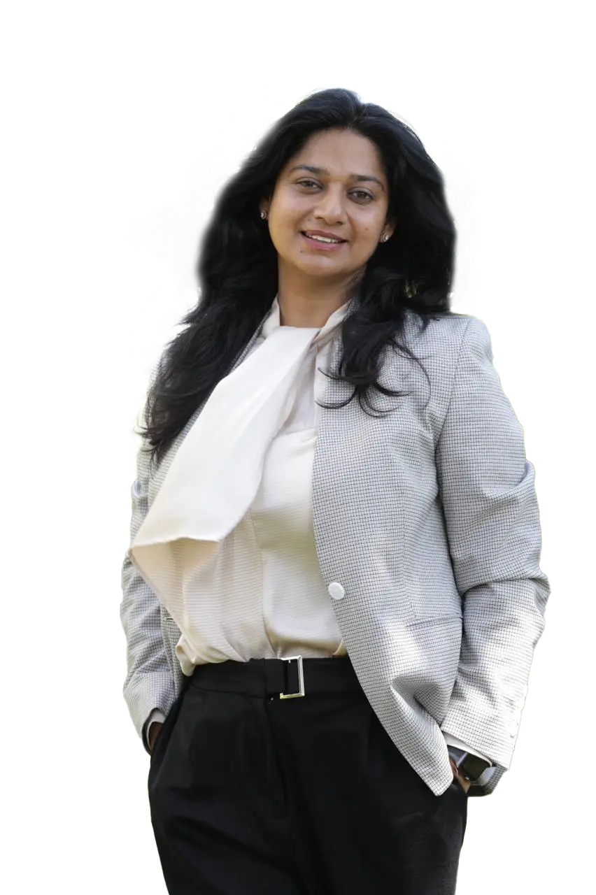 Dr. Rati Chandra emotional well-being coach smiling in professional attire specialising in stress management and mental wellness